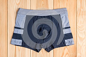 Quality cotton panties for boy clothes on wooden boards