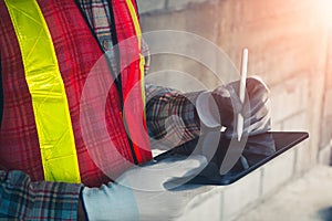 Quality inspection is streamlined as the engineer reviews data on the tablet