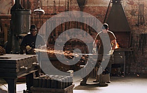 Quality is key. two metal workers working in a welding workshop.