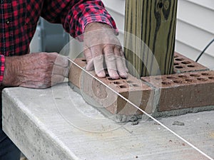 Quality, Master Bricklayer uses Level Line