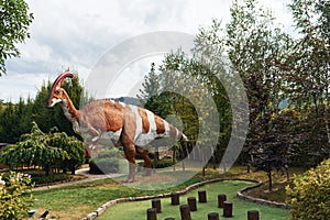 Quality replicas of dinosaurs in museum park outdoors at daytime