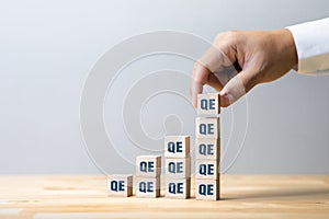 Quantitative easing or economy concepts with qe sign Increase photo