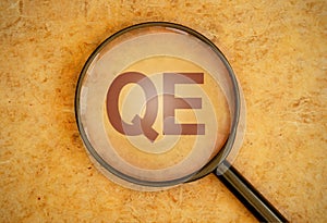 Quantitative easing magnifying glass photo