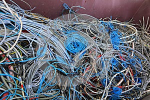 quantity of used electrical wires in the recycling container for the recycling of material and copper to safeguard the environment