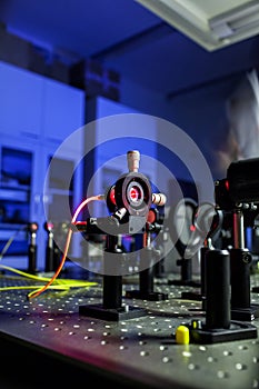 Quantum optics lab installations with laser, irises, appertures photo
