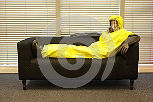 Quarantine - home arrest, man in protective uniform waiting.