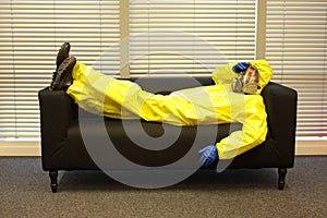 Quarantine - home arrest, man in protective uniform waiting.