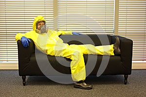 Quarantine - home arrest, man in protective uniform waiting.