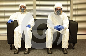 Quarantine. People in professional protective uniforms waiting for the end