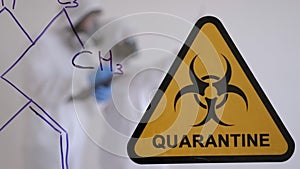 Quarantine. Quarantine warning sign on a glass door in hospital isolator.COVID19