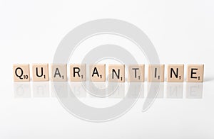 Quarantine spelled in tiles photo