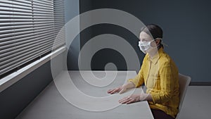 Quarantined scared woman with surgical mask