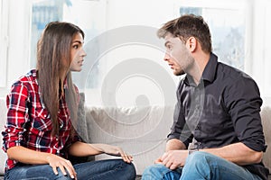 Quarreled couple in their living room