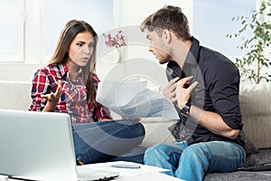 Quarreled couple with unpaid bills photo
