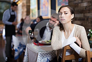 quarreled visitors female and male in restaurant