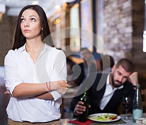 quarreled visitors female and male in restaurant