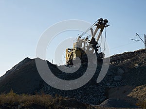 Quarry excavator working near railroad