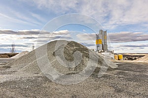 Quarry for the extraction of sand and stone, its transformation into gravel and cement manufacturing