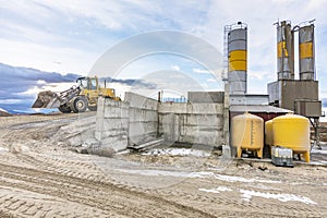 Quarry for the extraction of sand and stone, its transformation into gravel and cement manufacturing