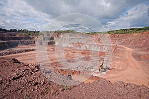 Quarry mine of porphyry rock. driller in a mine