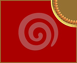 Quarter Almonds arranged in circle in Golden plate on vivid red background background