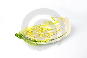 a quarter of Chinese cabbage cut isolated on white background