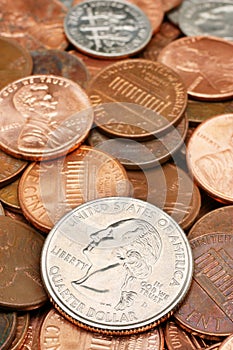 Quarter Dollar coin closeup over coins
