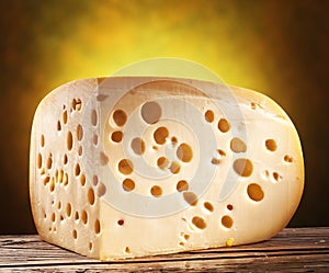 Quarter of Emmental cheese head. photo