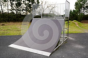 Quarter pipe ramp playground for skate practicing skateboarding adventure sport in public park