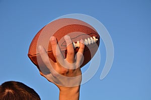 Quarterback Passing an American Football photo