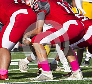 Quarterback receving ball from the center