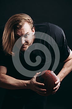 Quarterback throwing a football in a professional football game