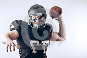 Quarterback throwing a football in a professional football game