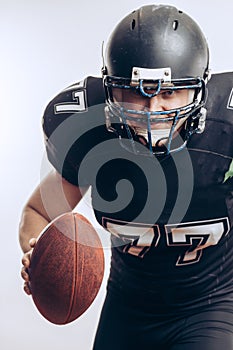 Quarterback throwing a football in a professional football game