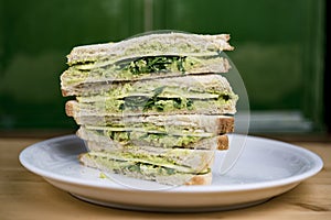 Quartered and stacked avocado sandwich