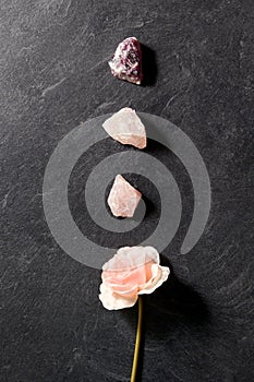 Quartz crystals, gem stones and rose flower