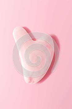 Quartz facial gua sha on pink background 3d vector realistic illustration, top view