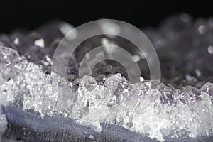 Quartz with mineral crystals against a black background