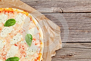 Quattro fromaggi pizza with basil