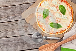 Quattro fromaggi pizza with basil