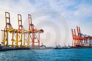 Quay crane standing on jetty harbor. Container handling equipment, heavy machinery for container logistics industry