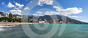 Quay of Yalta on the long exposure on the background mountains and blue sky 2