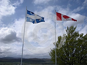 Quebec and Canada Flags Waving in the Wind