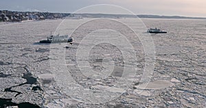 Quebec City ferries on Saint Lawrence River in winter from drone