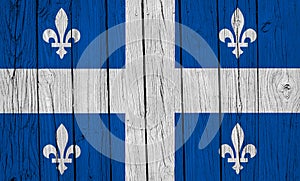 Quebec Flag Over Wood Planks photo