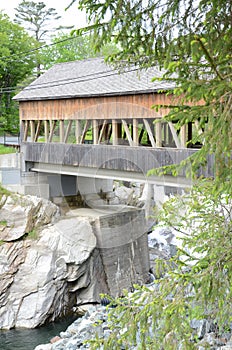 Quechee covered bridge in Canada with water below