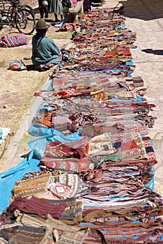 Quechua Indian woman selling blankets photo