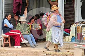 Quechua woman in traditional cloth at the market