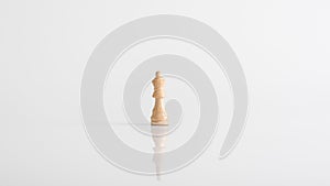 Queen chess piece on white table