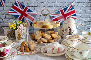 Queen Elizabeth II Platinum Jubilee cream tea street party food red white and blue flags  with celebration Union jack food toppers photo